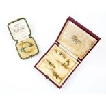 Five antique brooches, one diamond and pearl set hunting horn in 18 ct, another seed pearl set cross