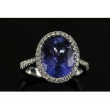 Tanzanite and diamond dress ring, oval cut tanzanite, of good colour, estimated total weight 5.00