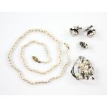 A group of pearl jewellery, including a graduated pearl necklace, strung with knots, gold clasp