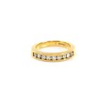 Half eternity ring, channel set with brilliant cut diamonds, in 18 ct gold mount, ring size M.