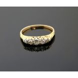 Victorian five stone diamond ring set with old cut stones in scroll setting, unmarked gold testing