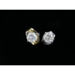 A pair of round brilliant cut diamond stud earrings, estimated total weight 0.40 carats, post and