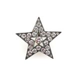 Art Deco period diamond star pendant, set in silver, the central diamond 0.15 carat, with total