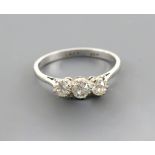 Three stone claw set diamond ring, total diamond weight estimated at 0.55 carats, set in 18 ct white