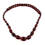 1930's red Bakelite type necklace, graduated oval beads, the largest bead 2.5 x 1.8cm, strung