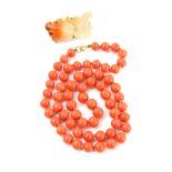 A coral bead necklace, single strand to a bolt ring clasp, length 54 cm, bead size 7 -8 cm and a