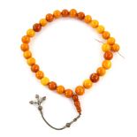 Amber bead necklace, thirty three round amber beads, 17mm in diameter, butterscotch yellow to orange