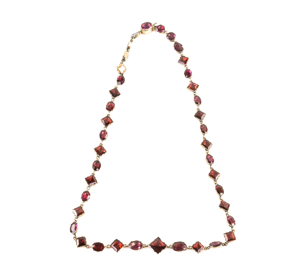 Late Georgian riviere necklace, with oval, round and diamond shaped cut foil backed garnets,