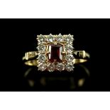 Diamond and ruby set dress ring, the central step ruby within a border of brilliant cut diamonds,