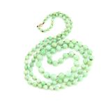 Long jade bead necklace, round graduated beads, 3mm to 9mm in diameter, strung with knots, bolt ring