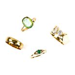 A group of gold rings, one abstract form set with cubic zirconia, ring size N, another set with