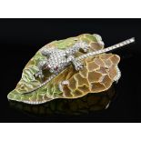 Moira jewellery design a naturalistic frog on leaf brooch the frog pave set with diamonds and with