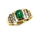Emerald and diamond ring, central step cut emerald, estimated weight 0.67 carats, with round