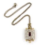 Diamond and ruby set pendant, the brilliant cut stones within milgrain border diamond weight