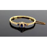 Late Victorian sapphire and diamond oval hinged bangle, claw set old cut diamonds, estimated total