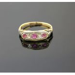 A Edwardian ring set with pink sapphire and rose cut diamonds, mount testing as 18 ct gold, ring