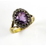 Amethyst and diamond cluster ring, oval cut amethyst 9 x 8mm, surrounded by Swiss cut diamonds,