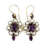 A pair of Victorian style amethyst and pearl drop earrings, marks for 9 ct, length 4 cm . White