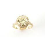 Fancy yellow diamond halo ring, central round brilliant cut diamond, estimated total weight 2.15