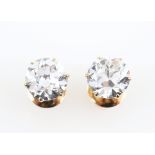 PLEASE NOTE ADDITIONAL INFORMATION, A pair of Art Deco period diamond stud earrings. the