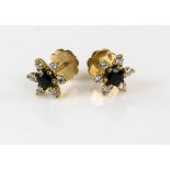 Sapphire and diamond flower head earrings, in 18 ct gold, fittings for pierced ears. 10 mm
