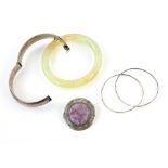 Collection of costume jewellery, engraved bangle, a pair of hoop earrings, purple stone set