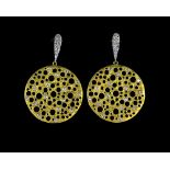 A pair of contemporary design earrings, set with diamonds, the drops of brushed gold with pierced