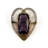 Large amethyst mounted in a silver gilt filigree heart form brooch, amethyst estimated at 45.00