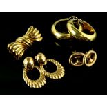 A group of gold jewellery, a vintage bow brooch, a pair of hoop earrings, another pair of button