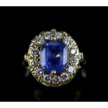 Vintage sapphire and diamond cluster ring, the central cushion shaped sapphire, with estimated