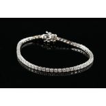 A Contemporary diamond line bracelet, set with round brilliant cut diamonds in 18 ct white gold,