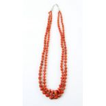 Native American Indian two strand coral bead and disc necklace, strung without knots to a silver