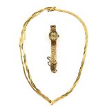 Ladies gold Accurist, oval baton hour markers, mechanical movement, textured case and bracelet,
