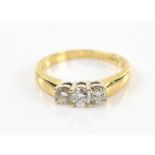 Three stone diamond ring, with round brilliant cut stones, total diamond weight estimated at 0.70