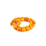 1920's amber graduated bead necklace, largest oval bead, 21 x 16mm, strung without knots, bolt