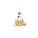 A small ivory okimono, for personal devotion, of a Buddhist Deity, seated in dhyanasana, with both