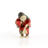 A Yasuaki (Homei) School coloured ivory netsuke of Okame, holding on to the hem of her red kimono;