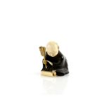 A wood and ivory netsuke of the young Sesshu with the tiny rat at Sokokuji Temple, unsigned, 19th or