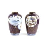 A pair of Fukagawa vases; each one decorated with fan designs of carp beneath momiji; 20cm high,