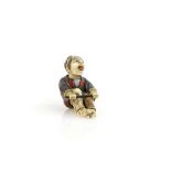 A Yasuaki (Homei) School netsuke of a seated man with articulated tongue and head; signed