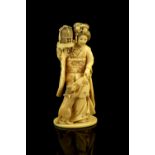 An ivory okimono, carved as a standing Yamato Nadeshko, holding a fan beside her cat, 13 cm High,