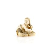 A stained ivory netsuke of a girl, washing her hair in a bowl, signed SeishiProvenance: The Property