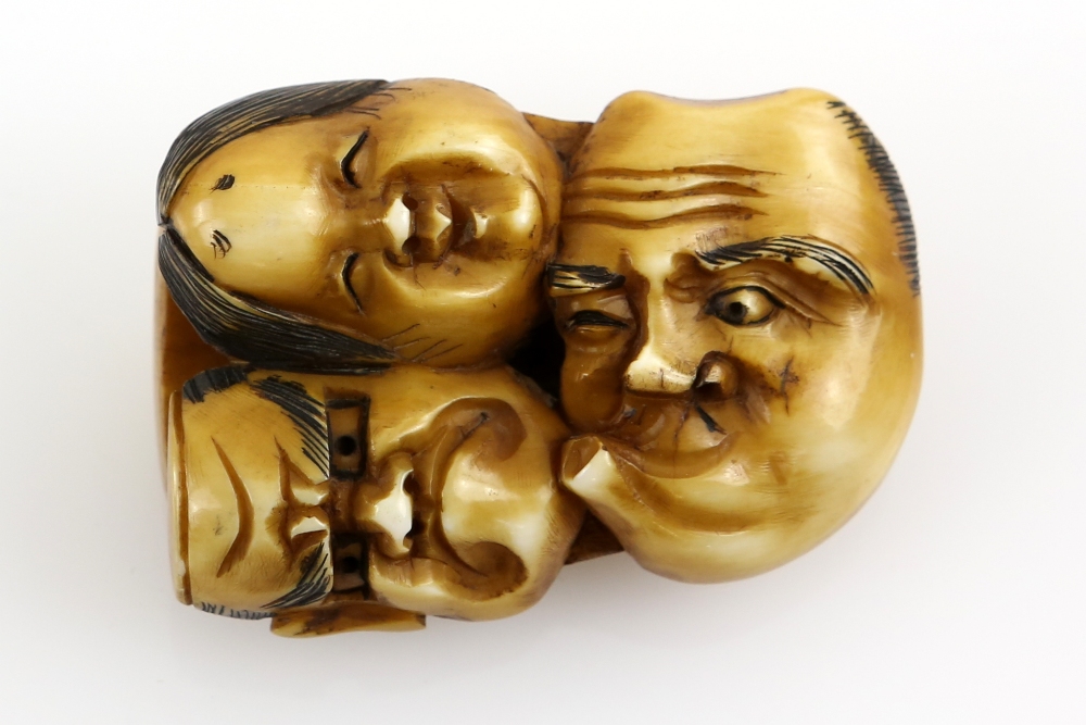 A stained ivory netsuke of four theatrical masks joined together, unsigned; together with another - Image 2 of 5