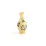 A small Chinese ivory vase, decorated on the exterior with floral designs, 6 cm high, the base