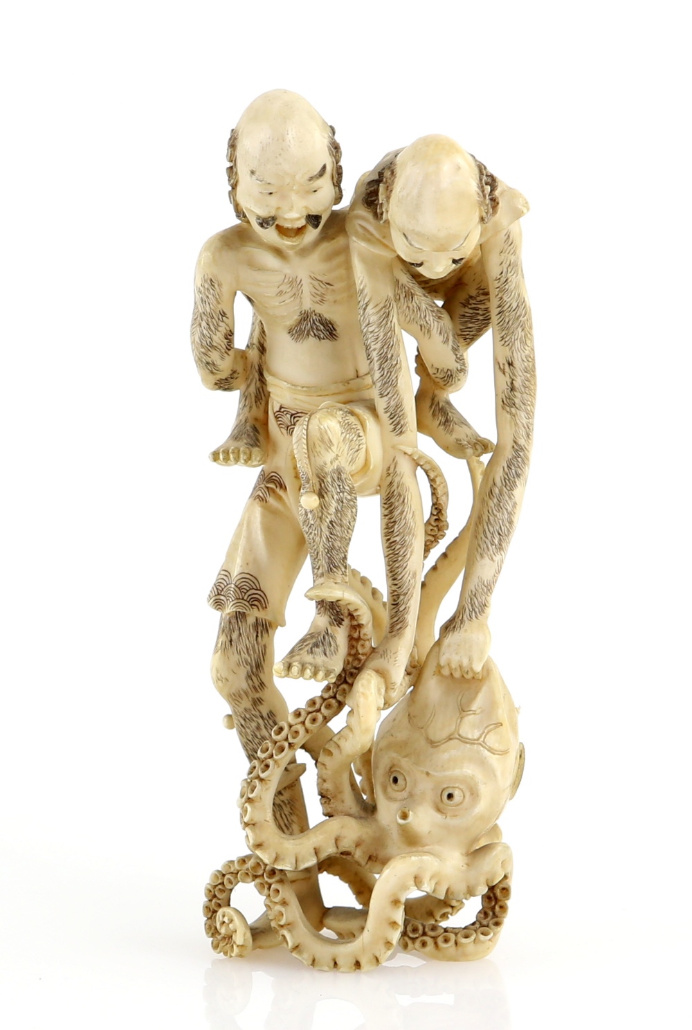 A stained ivory okimono of Ashinaga and Tenaga with an octopus, 11.5 cm high, Meiji