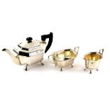 George VI silver three piece tea service, comprising teapot, cream jug and sugar bowl, of