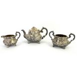 Victorian silver three-piece tea service, elaborately chased and with inscriptions, teapot with