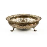 George V silver basket with pierced and scrolling decoration, on three claw feet, by James Dixon &