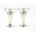 Edwardian pair of silver two handled vases, with flared bases, dove and olive branch crest, by