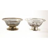 George V pair of silver baskets with pierced and beaded decoration, on round feet, by Henry